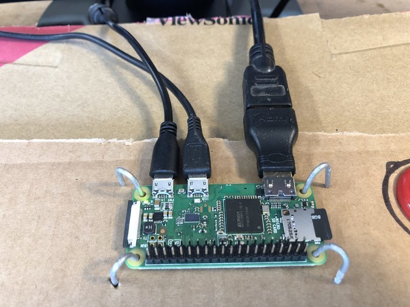 A Raspberry Pi held using Chicken Wire staples