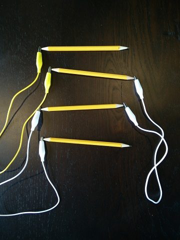 Pencils connected with alligator clips