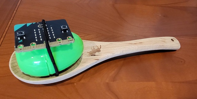 Spoon with egg attached to micro:bit