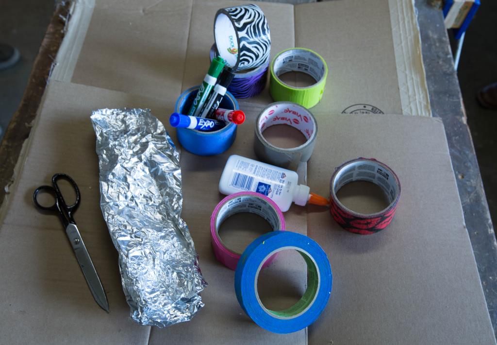 Materials: cardboard, tape, scissors, markers