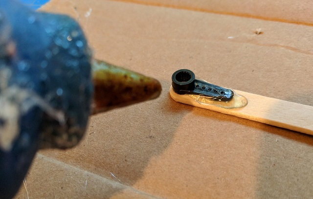 Glue the horns to the popsicle sticks