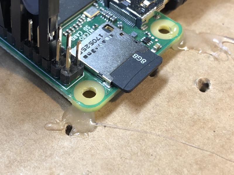 A Raspberry Pi help by hot glue on the corners